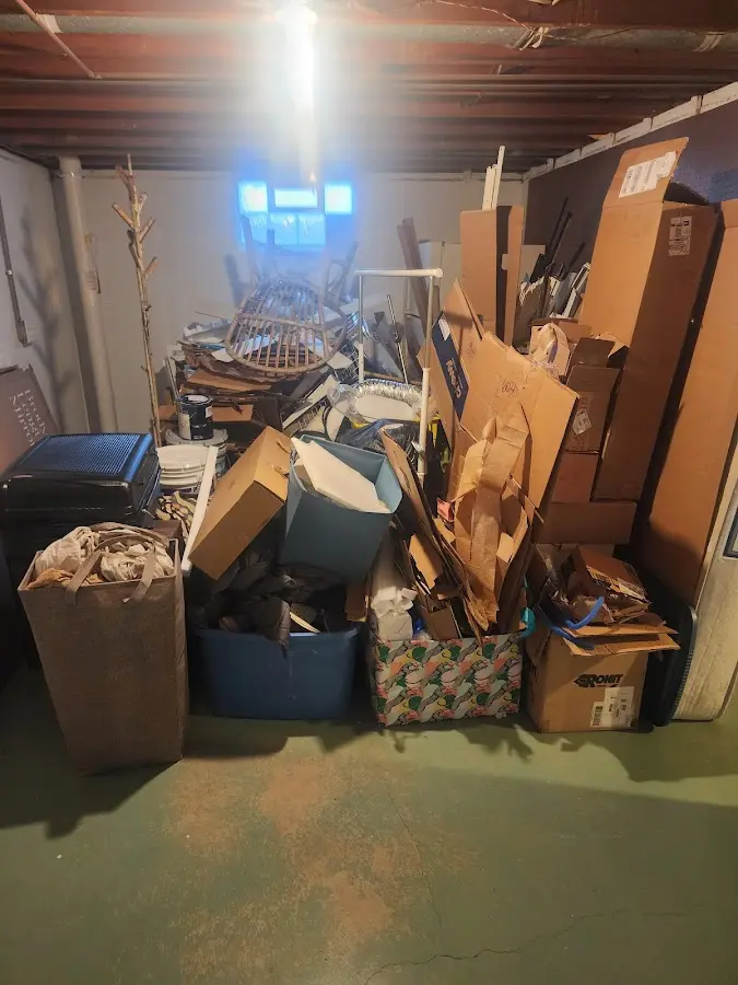 Roll-off dumpster container at job site for 8 Yard Dumpster Rental in Mills